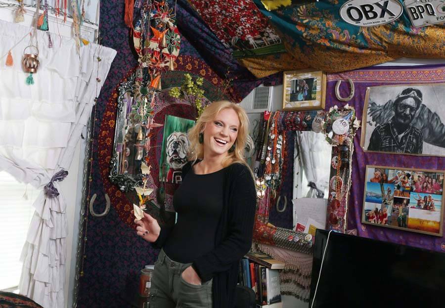 Chloe believes it's important to refer back to her old work to help spark new ideas or lift a creative block. "I will look back on certain projects and think, 'Dang! I can make this better now that I’ve learned more,'" Chloe says. Nashville artist posing in studio