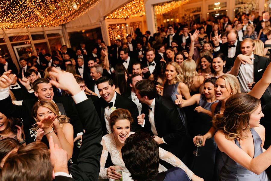 Packed dance floor at a winter wonderland wedding | Photographer: Kristyn Hogan