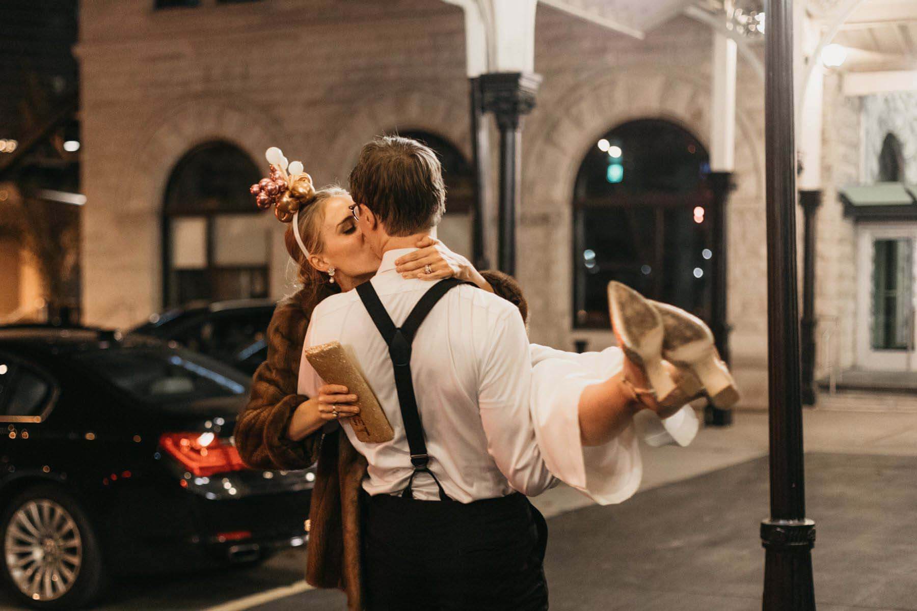 The bride and groom exit their autumn wedding at the Union Station Hotel