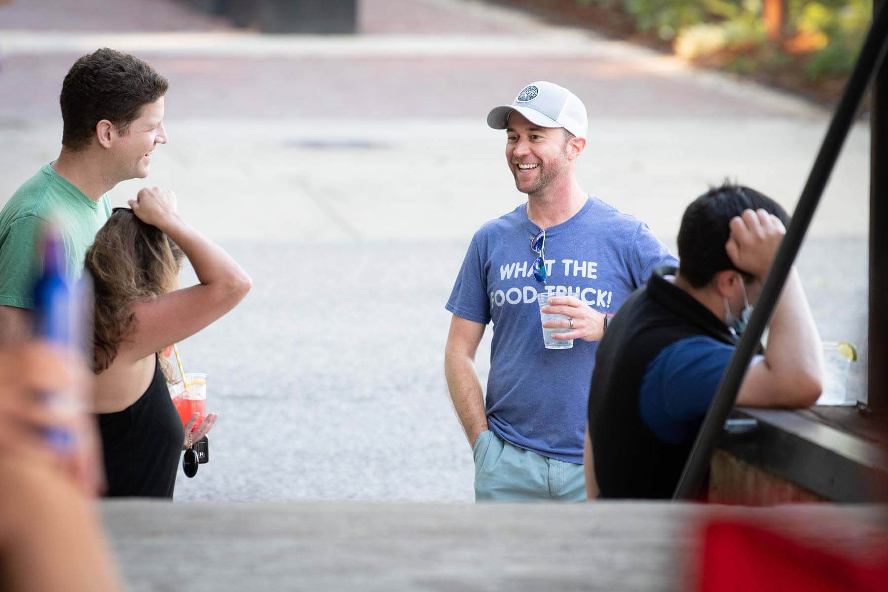 People socialize on the street at Pepper Place in Birmingham, Alabama.