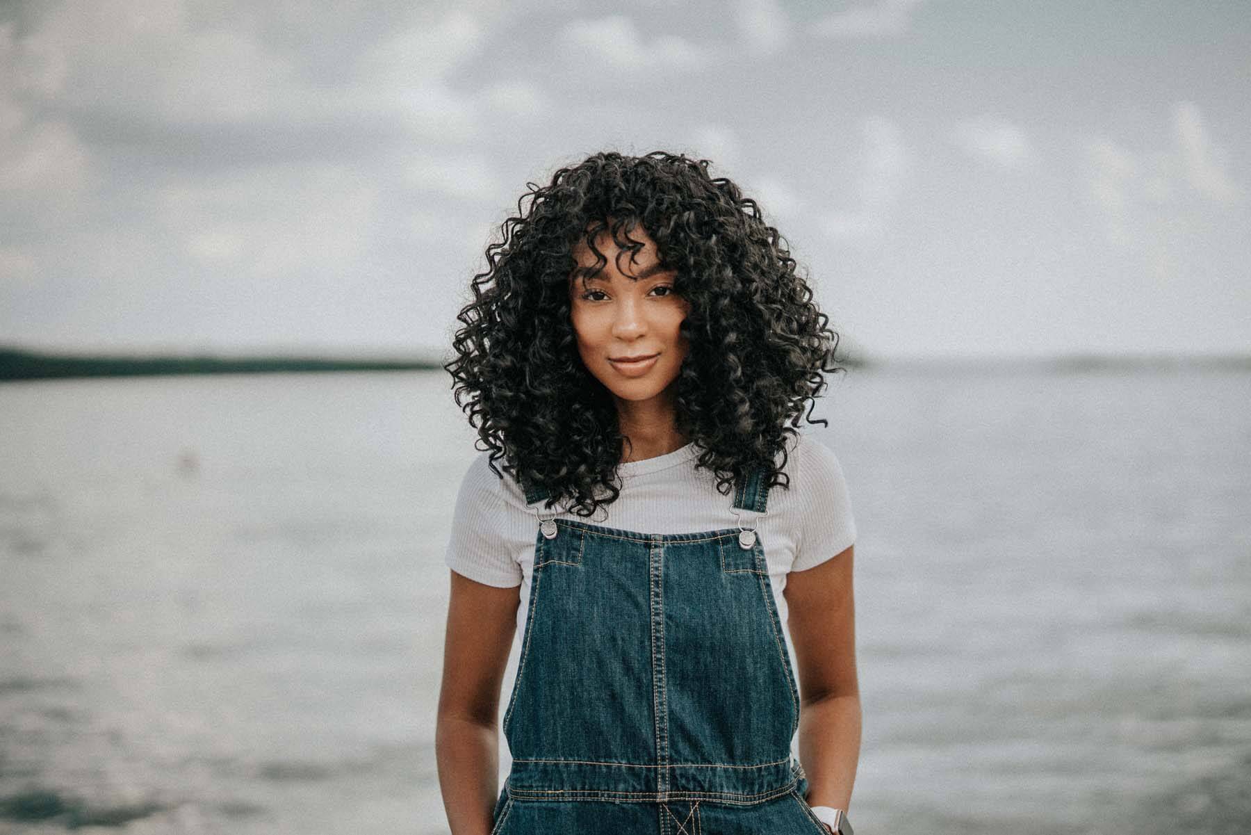 Tiera posing in front of a lake