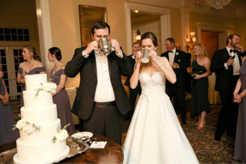 Bride and groom drinking from family heirloom cups