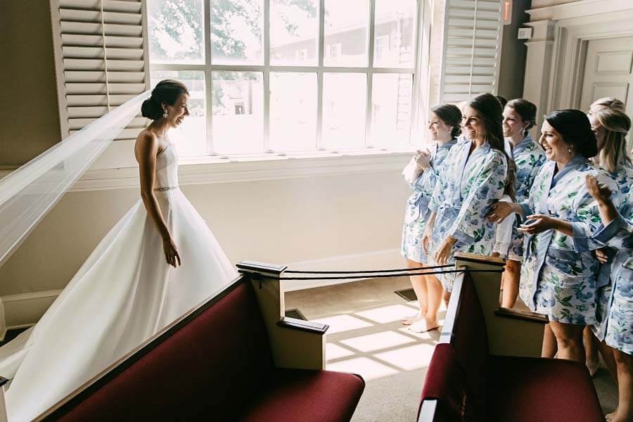 First look in the church with bridesmaids