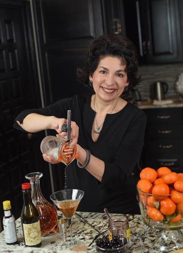 Peggy mixing a cocktail