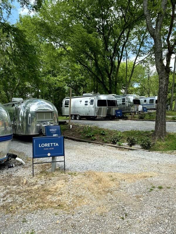 The vintage Airstream park is just one of the many accommodation options available at Wildwood Resort & Marina. Make note of the trailer names — Loretta and Dolly are just two of the nods to country music royalty. wildwood resort and marina in granville - trailer park