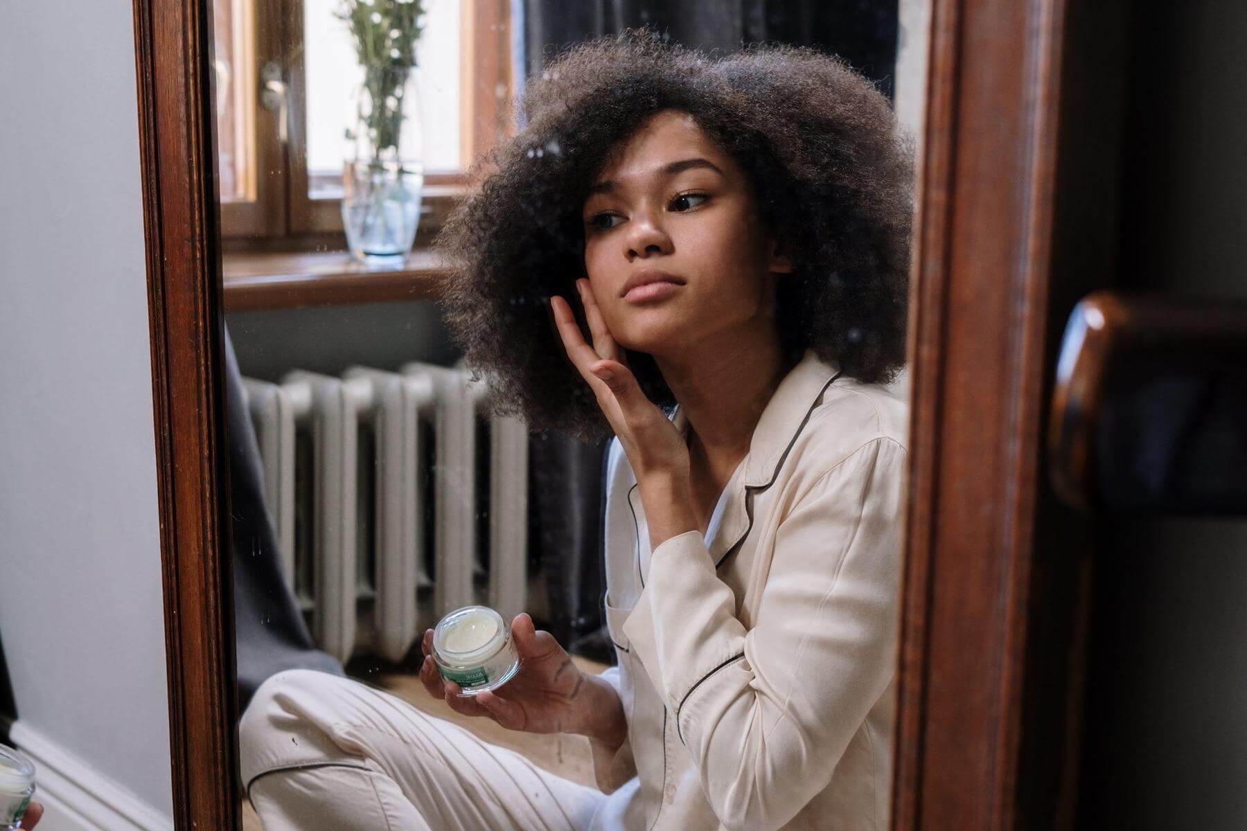 Woman prepping skin for winter