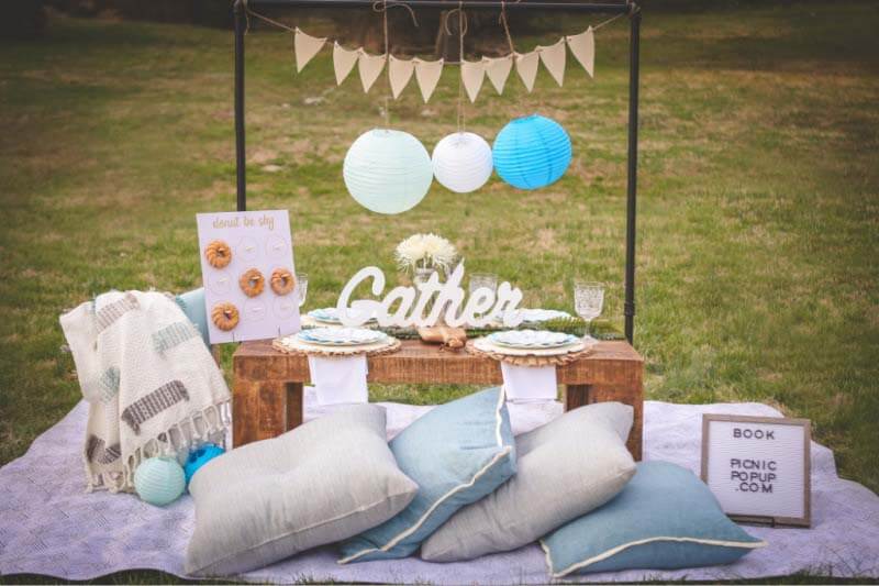 Picnic PopUp offers beautiful setups that range from romantic to kid-friendly to the adorable PupUp that indulges your favorite four-legged friends. A recent addition to the roster is "The Picnic PopUp @ The Field in Franklin," which offers an exclusive, front-row seat to a drive-in movie while you eat. "You park and walk up, and your picnic is set up for you," Jam explains. "You're socially distanced and roped off, and once you sit down, you have this huge movie screen adventure right in front of you. It feels like you're the only one there! It's incredible." Image: Picnic PopUp Picnic PopUp's "gather" theme — New Dining Experiences in Nashville