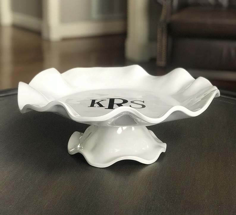 Monogrammed cake stand, starting at $66, from Doo-Dads & Designs | Image: Doo-Dads & Designs Monogramed cake stand from Doo Dads & Designs