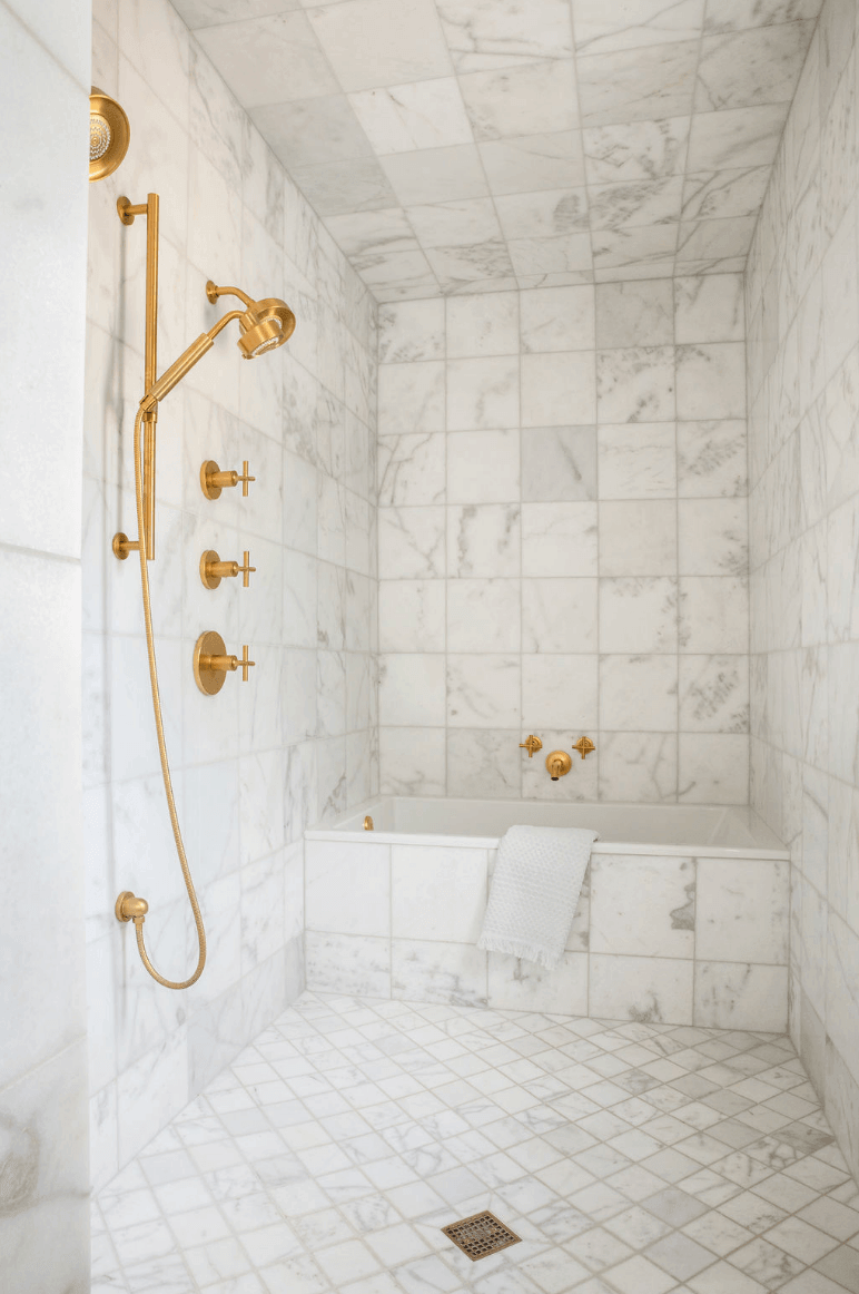 Tile shower with gold accents
