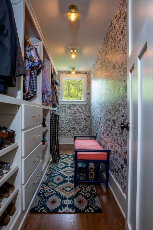 "His" master closet with cityscape wallpaper