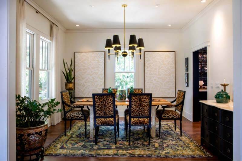 Dining room with cheetah-print chairs in Cherokee Park home