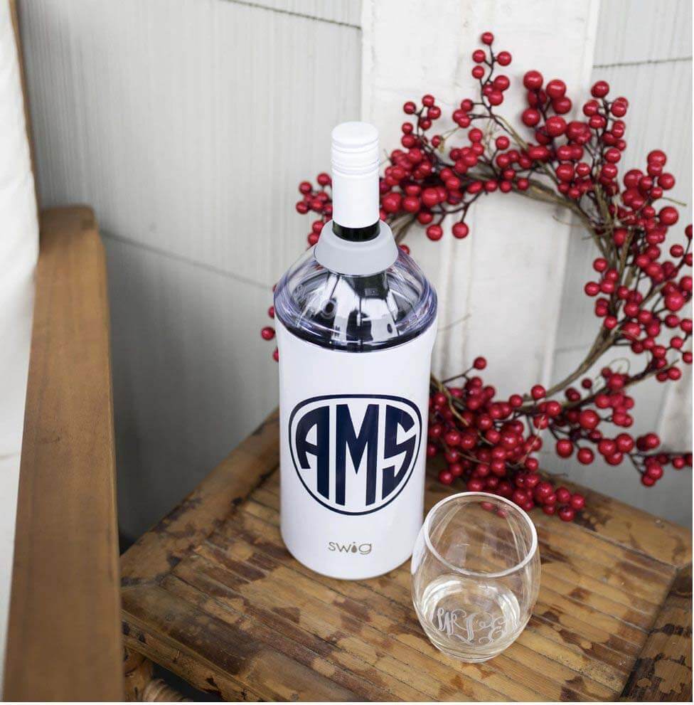 Monogrammed wine chiller and wine glass gift set, $160, here Monogrammed wine chiller and acrylic glass on table