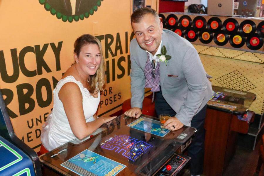 Tracie and Greg play Pac Man at Louisville Hay Market Bar