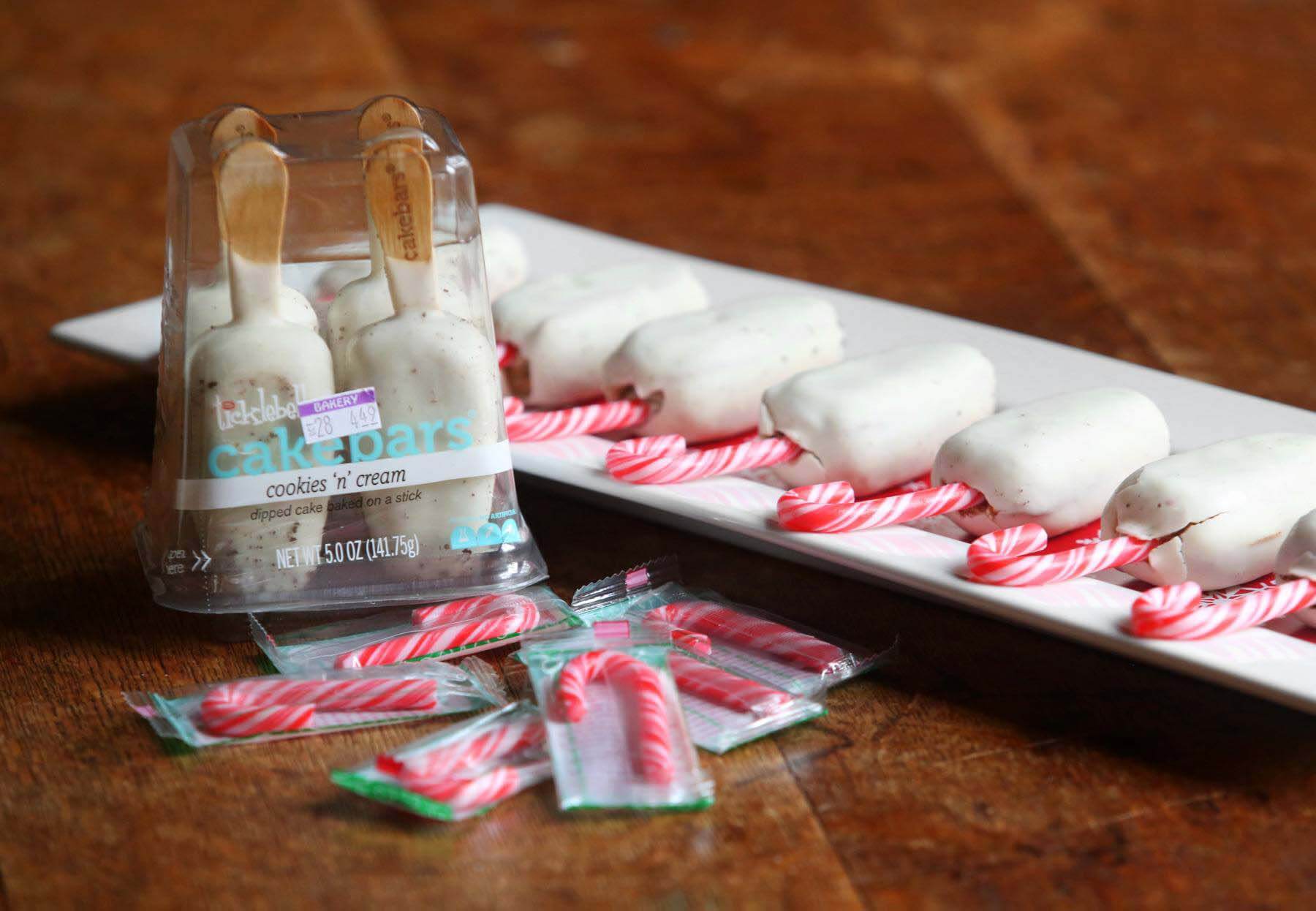 These candy cane cake bars are sure to satisfy any sweet tooth. Cake bars candy canes for a holiday party dessert
