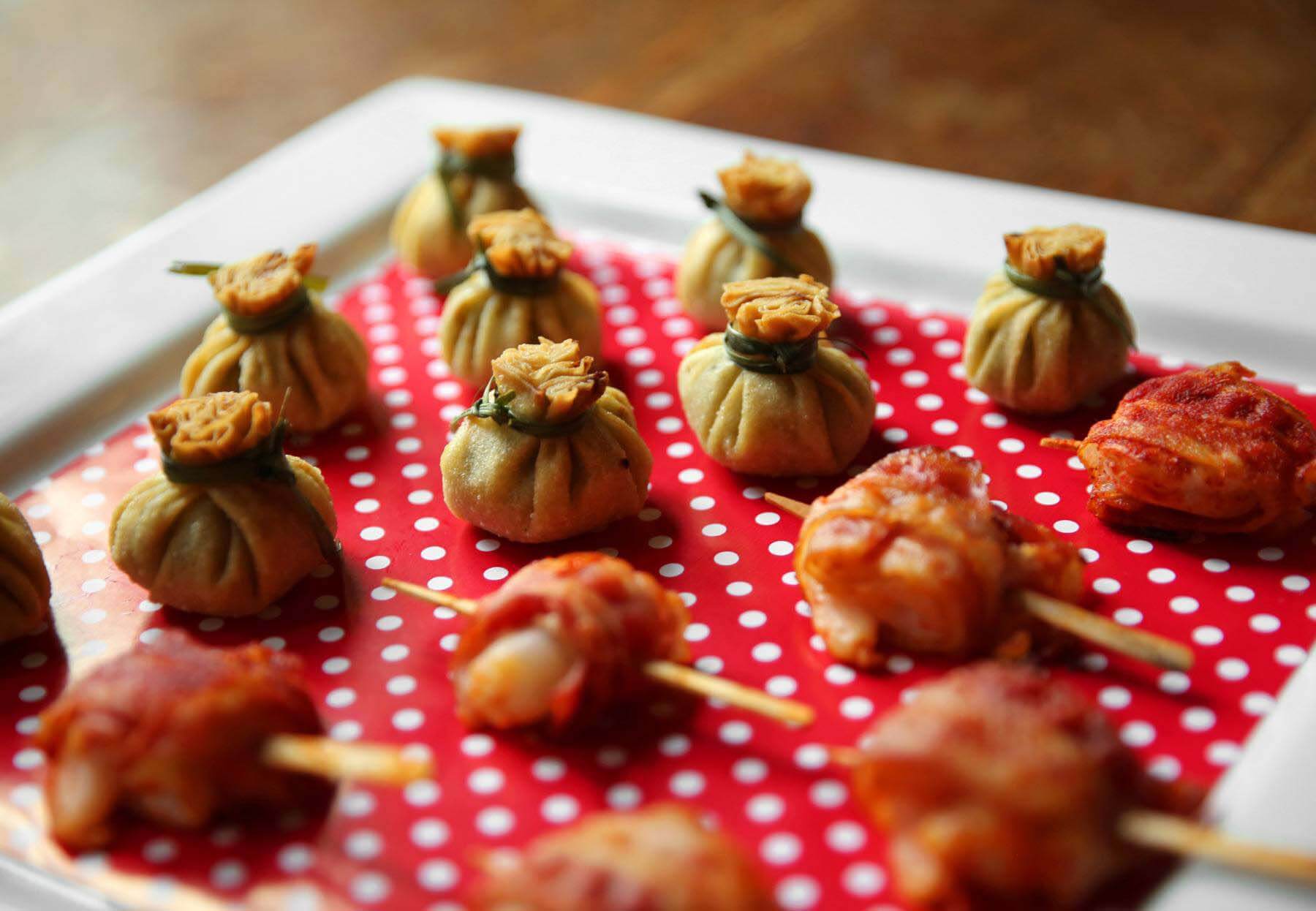 When it comes time to display the hors d'oeuvres, Amos suggests lining your serving platter with holiday wrapping paper for an extra festive touch. Private Selection frozen appetizer on a plate line with wrapping paper