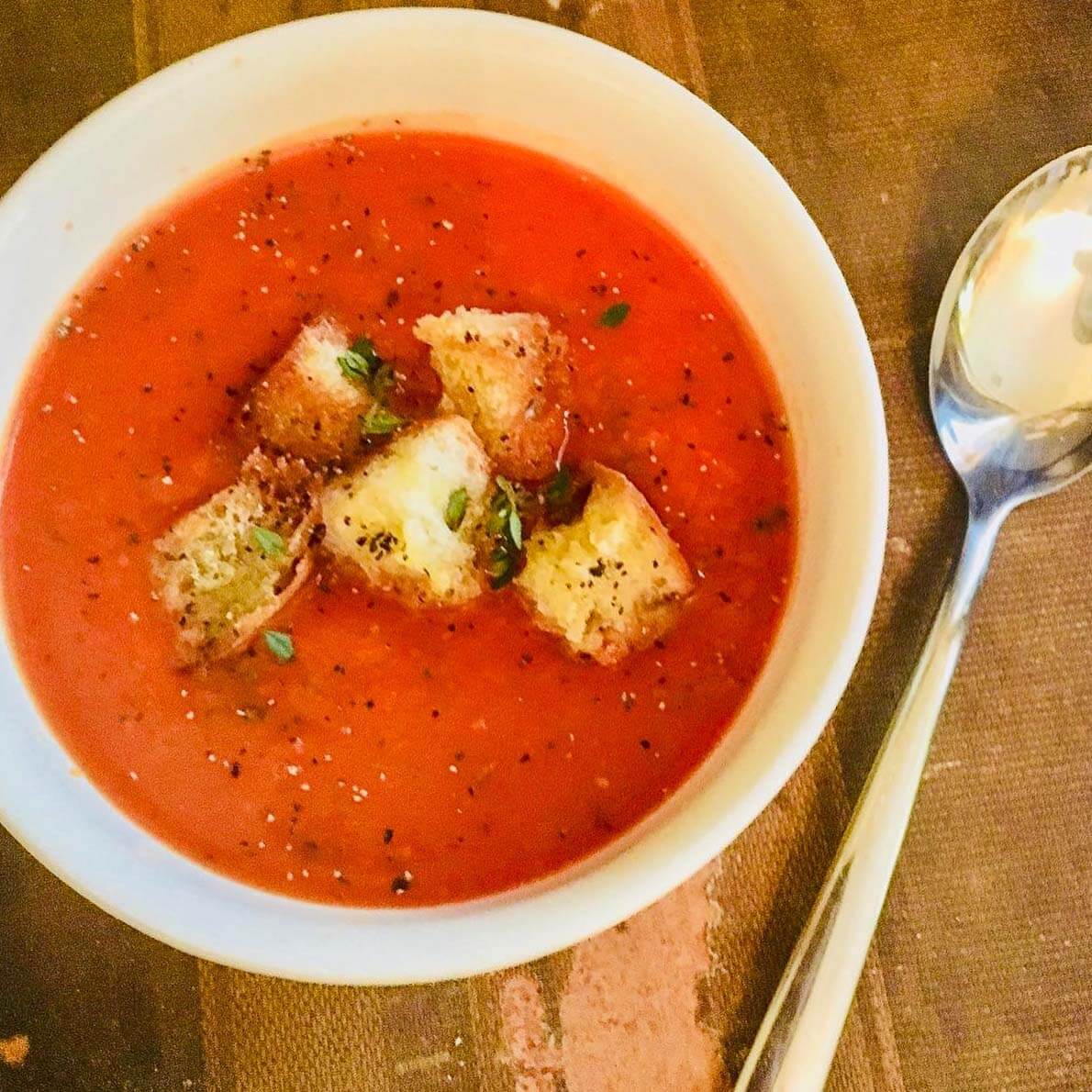 Warm and bursting with flavor, the Roasted Tomato Soup is perfect for a chilly fall evening. roasted tomato soup from Farm and Fig Catering