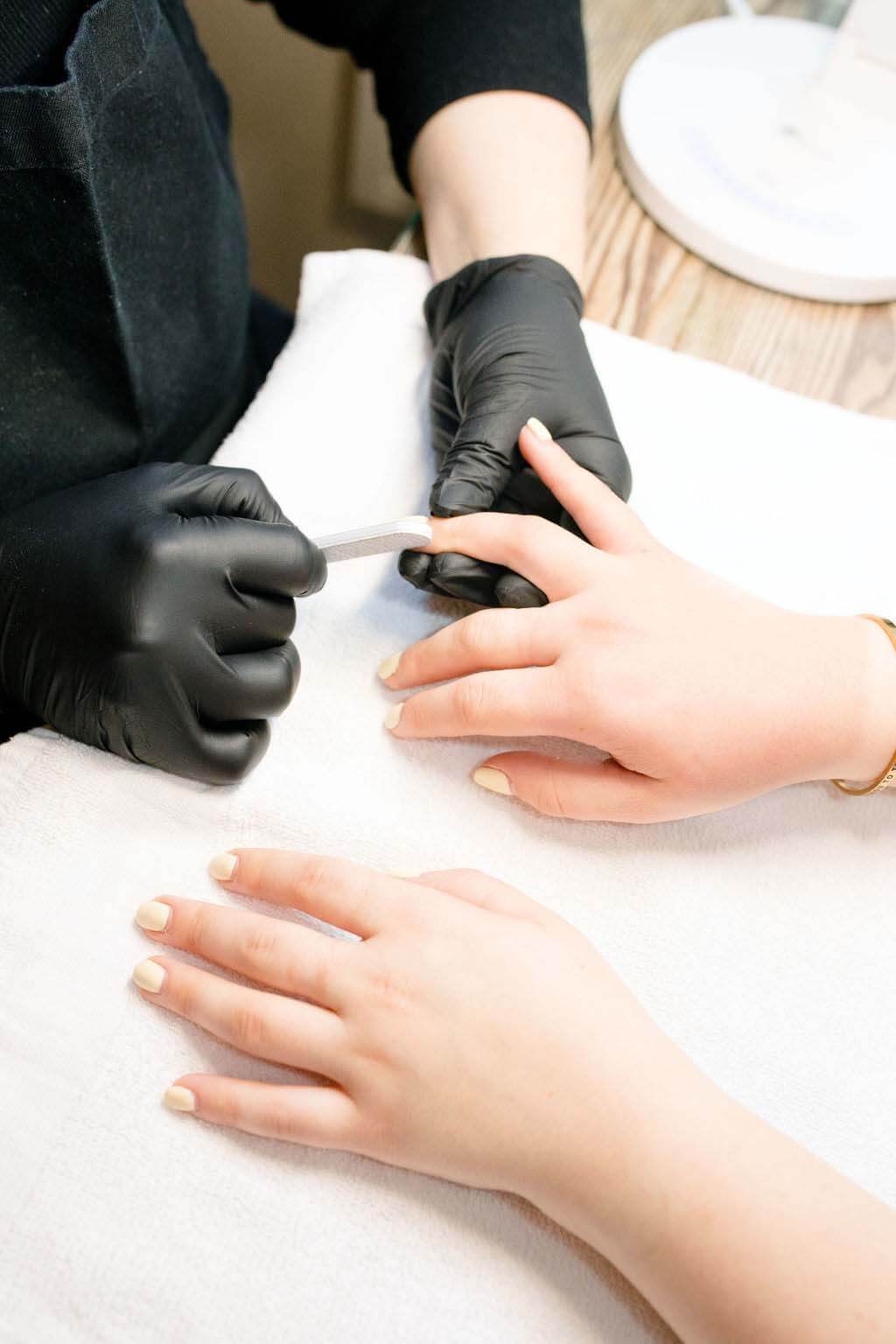 Whether you opt for gel, Dazzle Dry or standard polish, it's time to give your nails a little holiday cheer. Image: Mandy Reid A manicure in progress