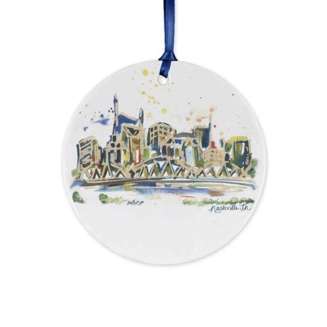 Erika Roberts Studio Nashville ornament, $25, here | Image: Erika Roberts Studio Ornament with Nashville skyline watercolor painted on it
