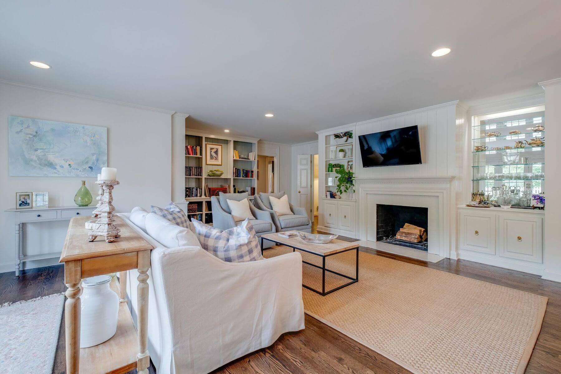 Living room with fireplace and built-in bookcases in ranch home renovation