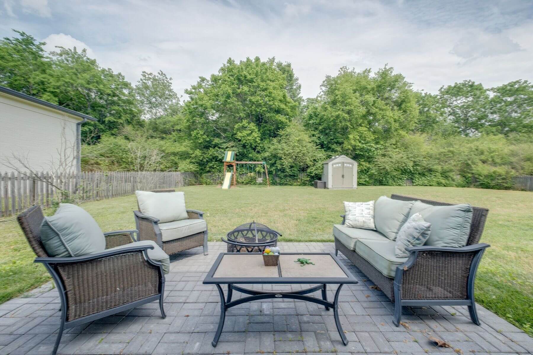 New patio space with outdoor furniture at Green Hills ranch home renovation