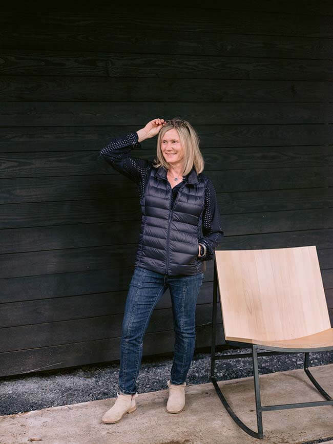 Kelley Bishop standing next to modern rocking chair