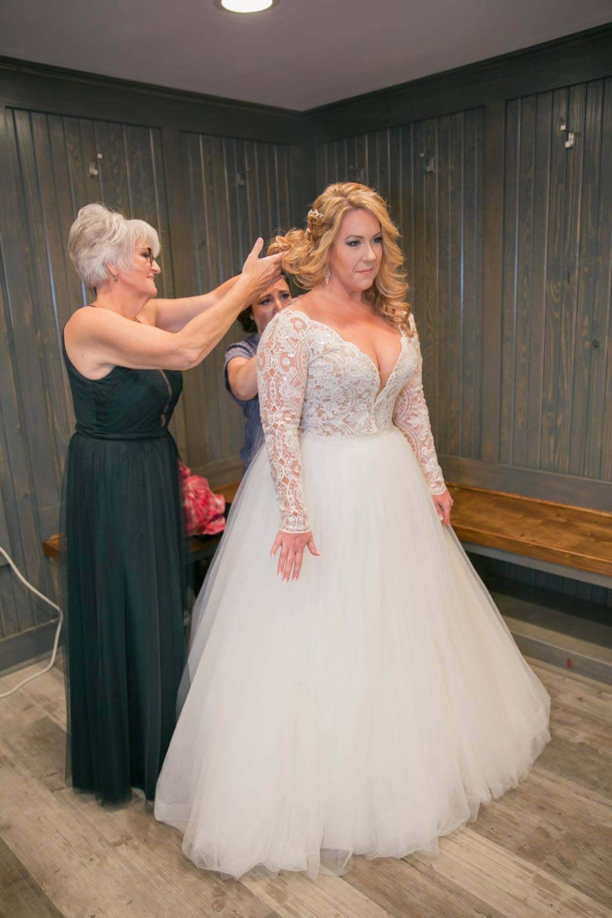 "My dress was a piece of art," Sarah says of the stunning gown she found at Glitz Nashville. Bride getting ready at Belle Meade Plantation