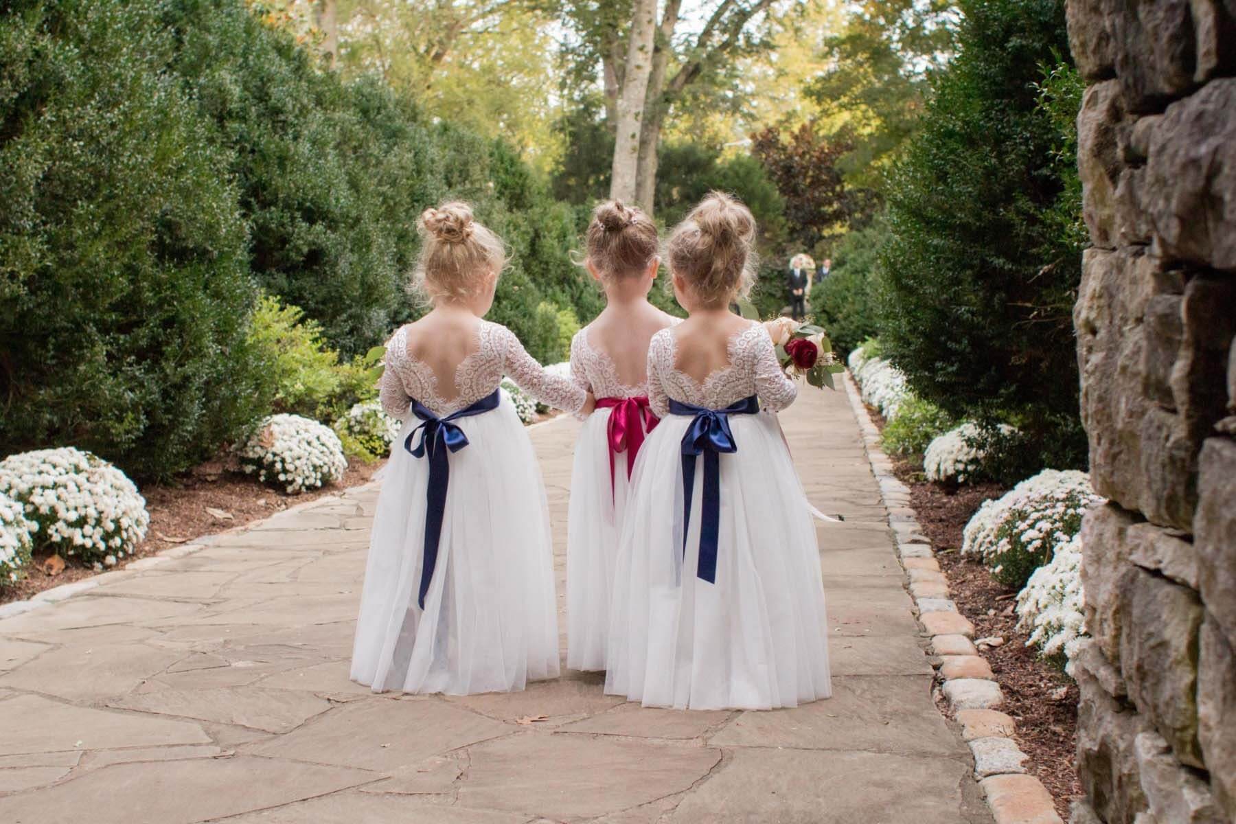 With five young nieces between them, Sarah and Douglas had the sweetest little flower girls! Flower girls walking down the aisle