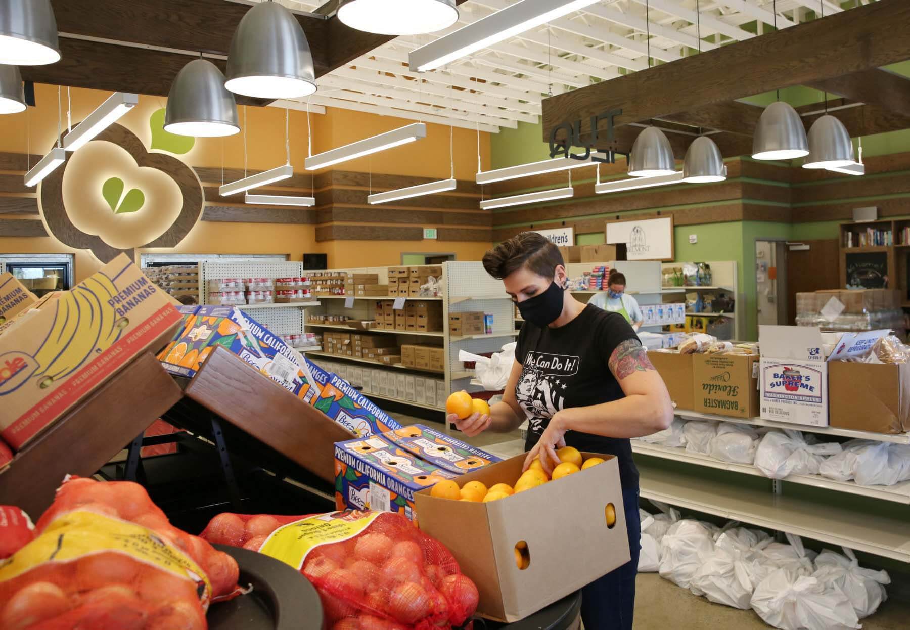 Courtney organizing produce items