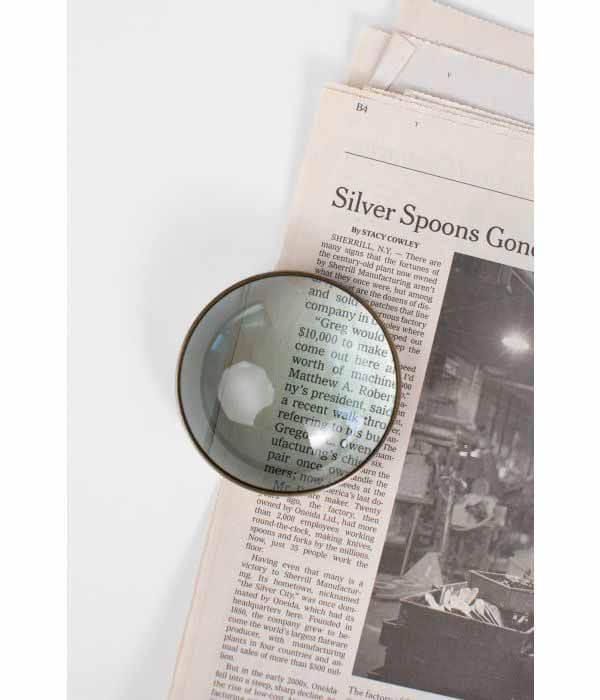 Magnifying paperweight, $20.99, at Ten Thousand Villages | Image: Ten Thousand Villages Magnifying glass paperweight from Ten Thousand Villages