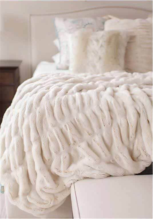 Couture faux fur throw, $350, at Providence Interiors | Image: Providence Interiors Faux fur throw from Providence Interiors