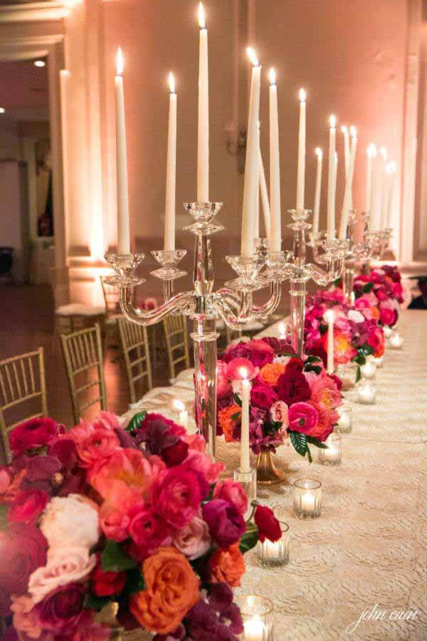 Candelabras and flowers on table for Valentine's Day wedding
