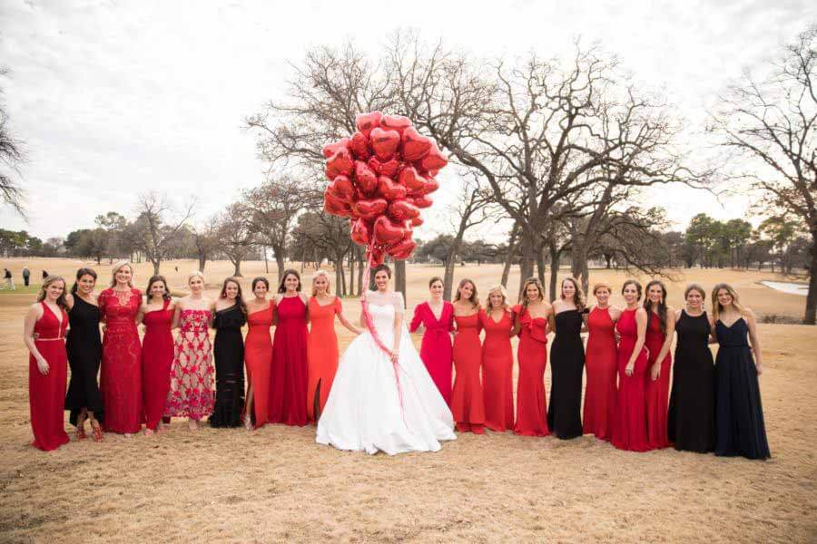 Heart balloons and wedding party outside