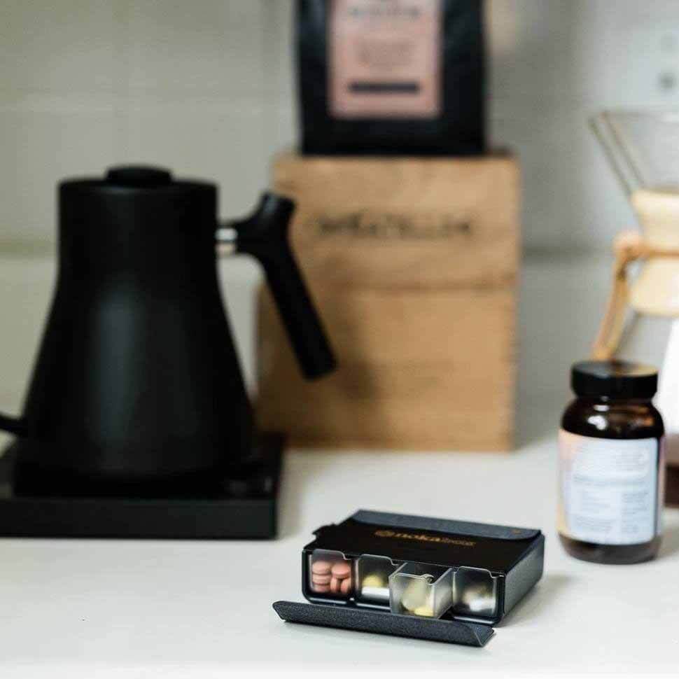 Noka Supply’s Nokabox is sleek, stylish, functional and travel-friendly. Black pillbox on counter
