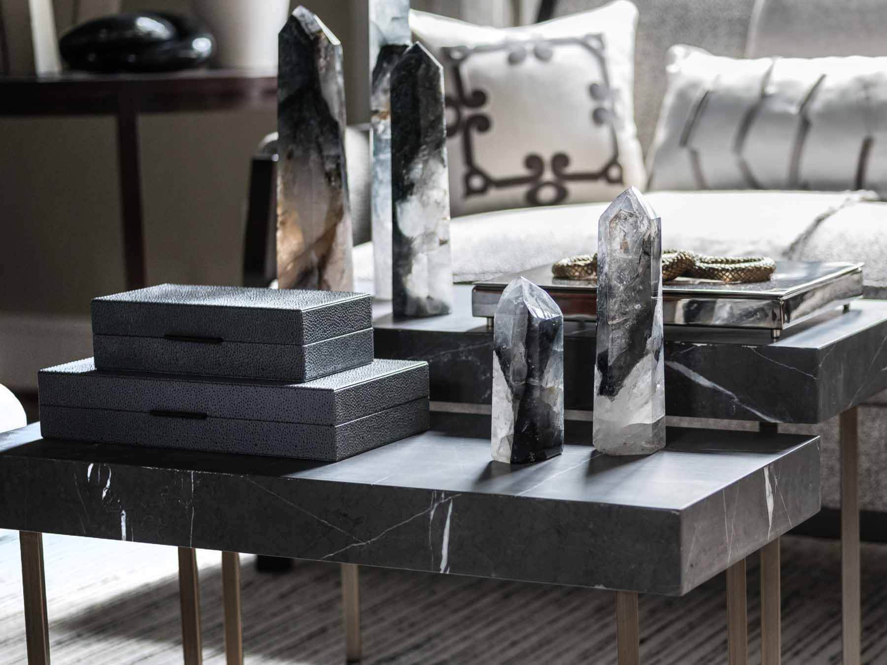 Jonathan Savage design with stone obelisks and upholstered boxes
