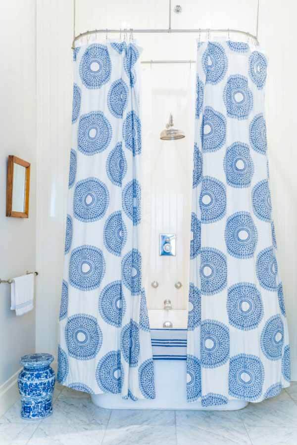 Blue and white shower curtain in bathroom