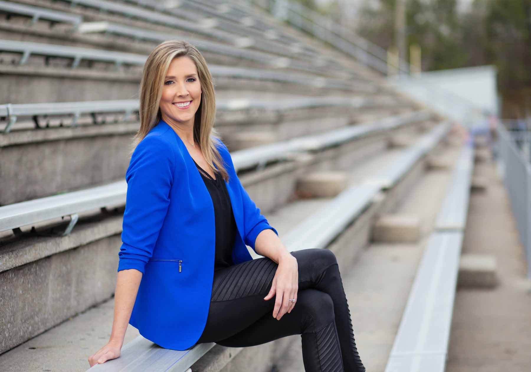 Lauren Sisler sitting on outdoor bleachers
