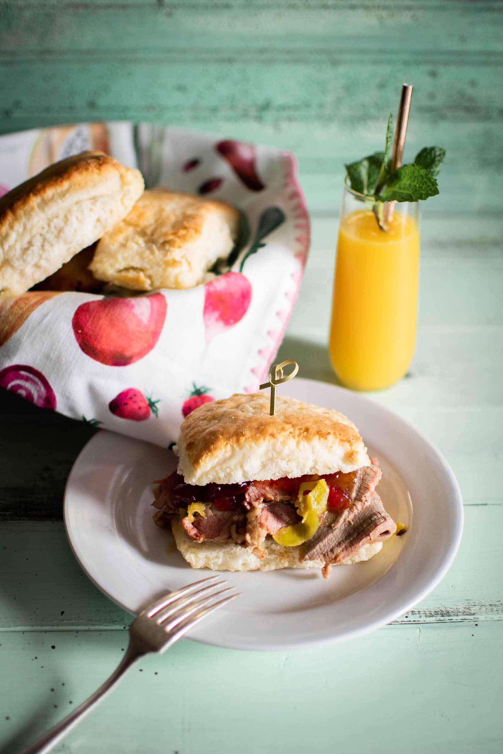 The popular Brisket Biscuit features chili-spiced beef brisket, beer-braised with onions and pepperoncini peppers and topped with pepper bacon jelly. Image: Hannah Joyce Photography Brisket Biscuit from By the Brewery, a new Memphis restaurant