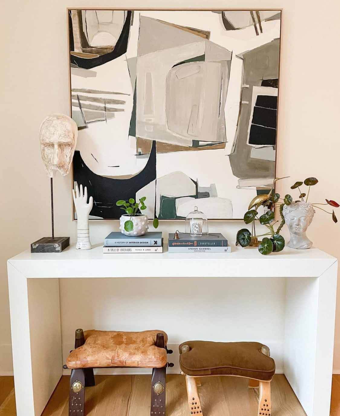 Painting by Sarah Ella Cole hanging above table