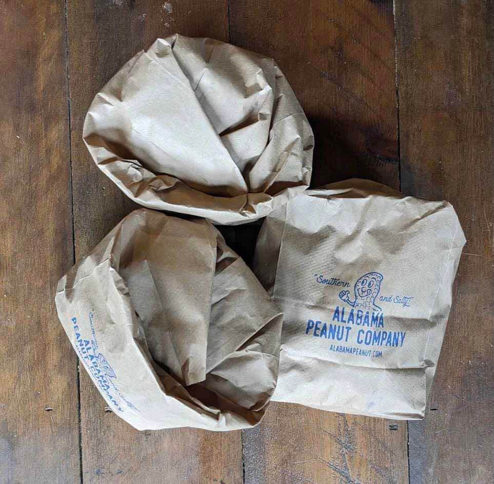 Three bags of Alabama Peanut Company peanuts