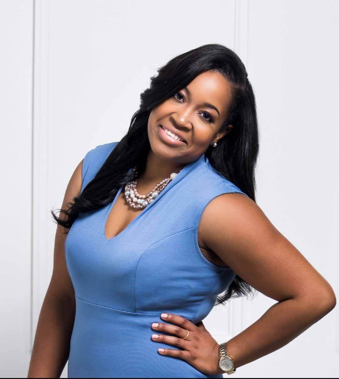 Lori posing in blue dress