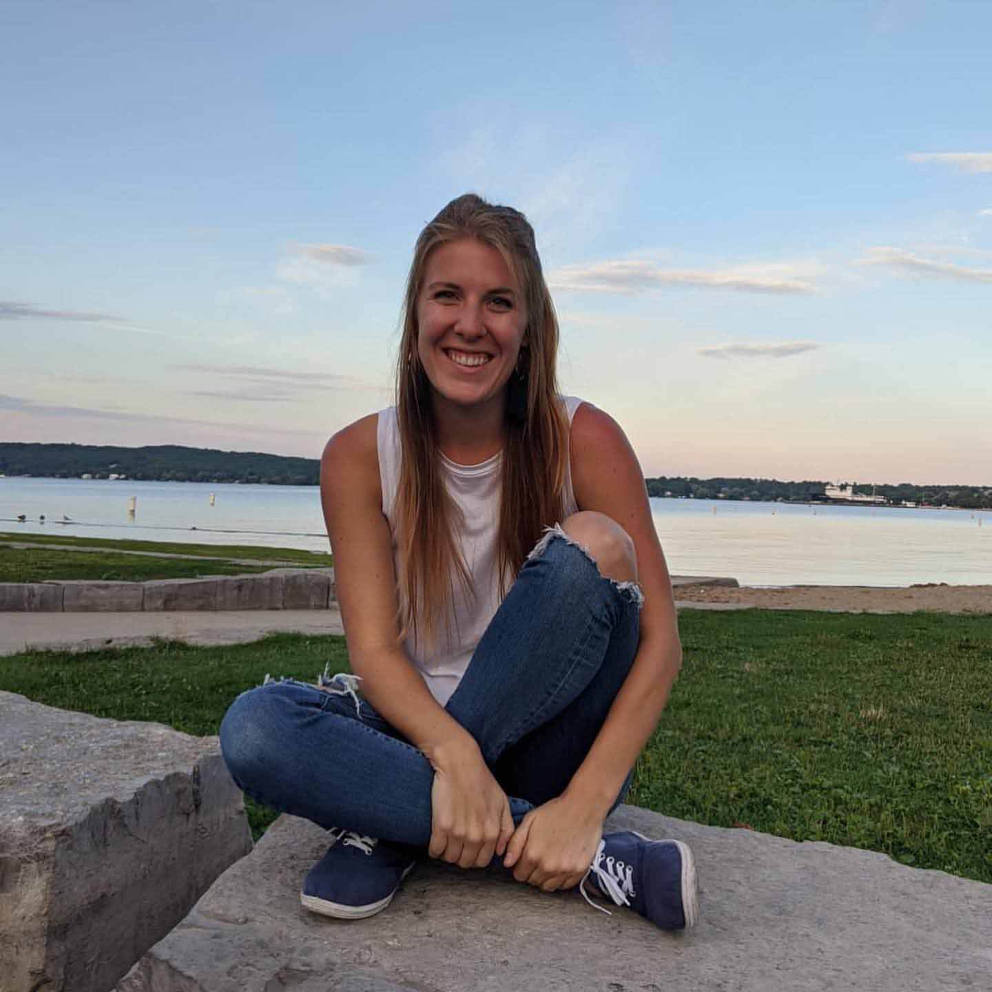"I’m 27, so I’m still shooting for 30 under 30," says Savannah. "Working towards that goal is something fun!" Savannah Cleveland in front of a lake