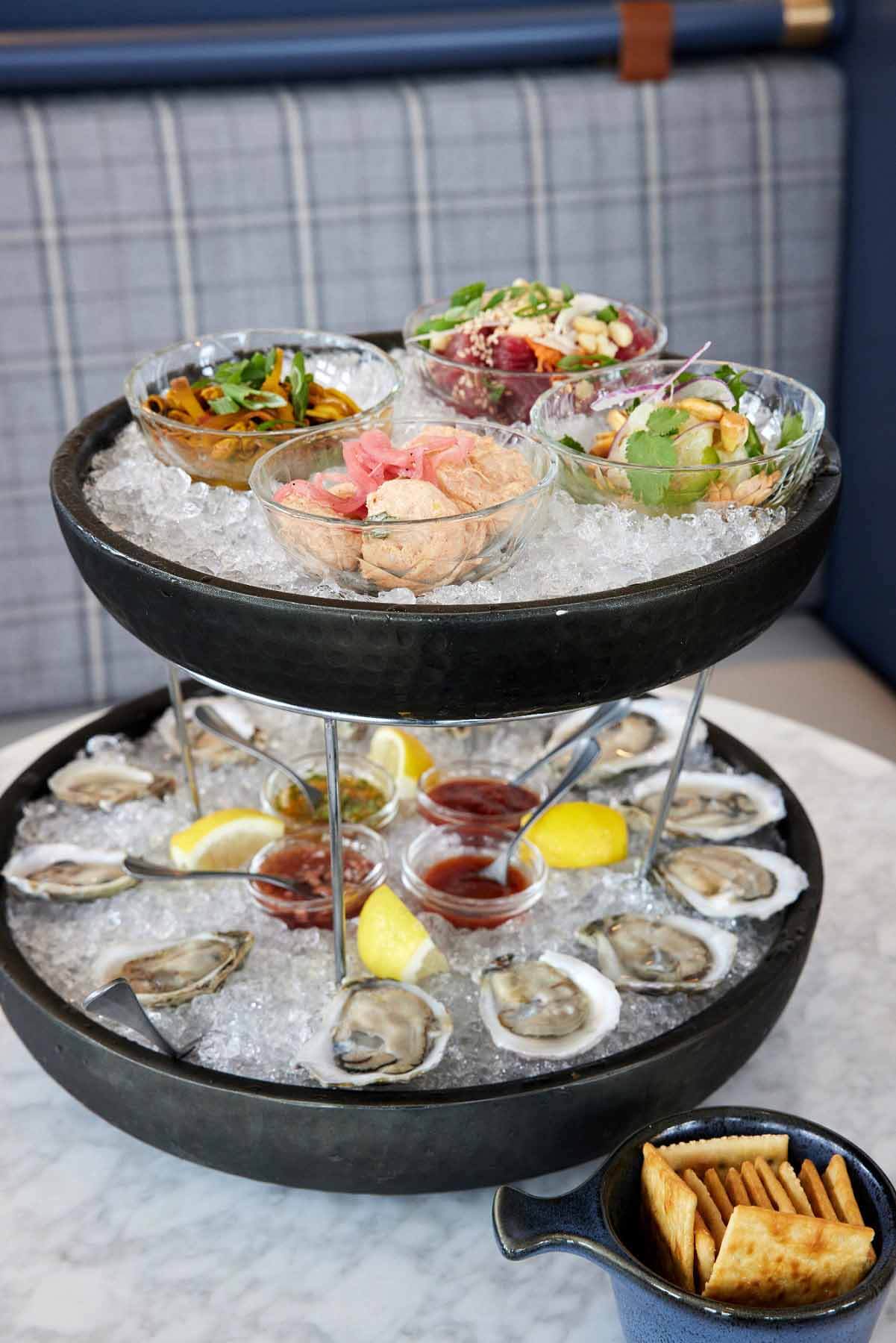 The seafood tower at The Citizen is stacked high with some of the freshest seafood you'll find anywhere. Image: Devote Studios Seafood spread from The Citizen at Alys Beach