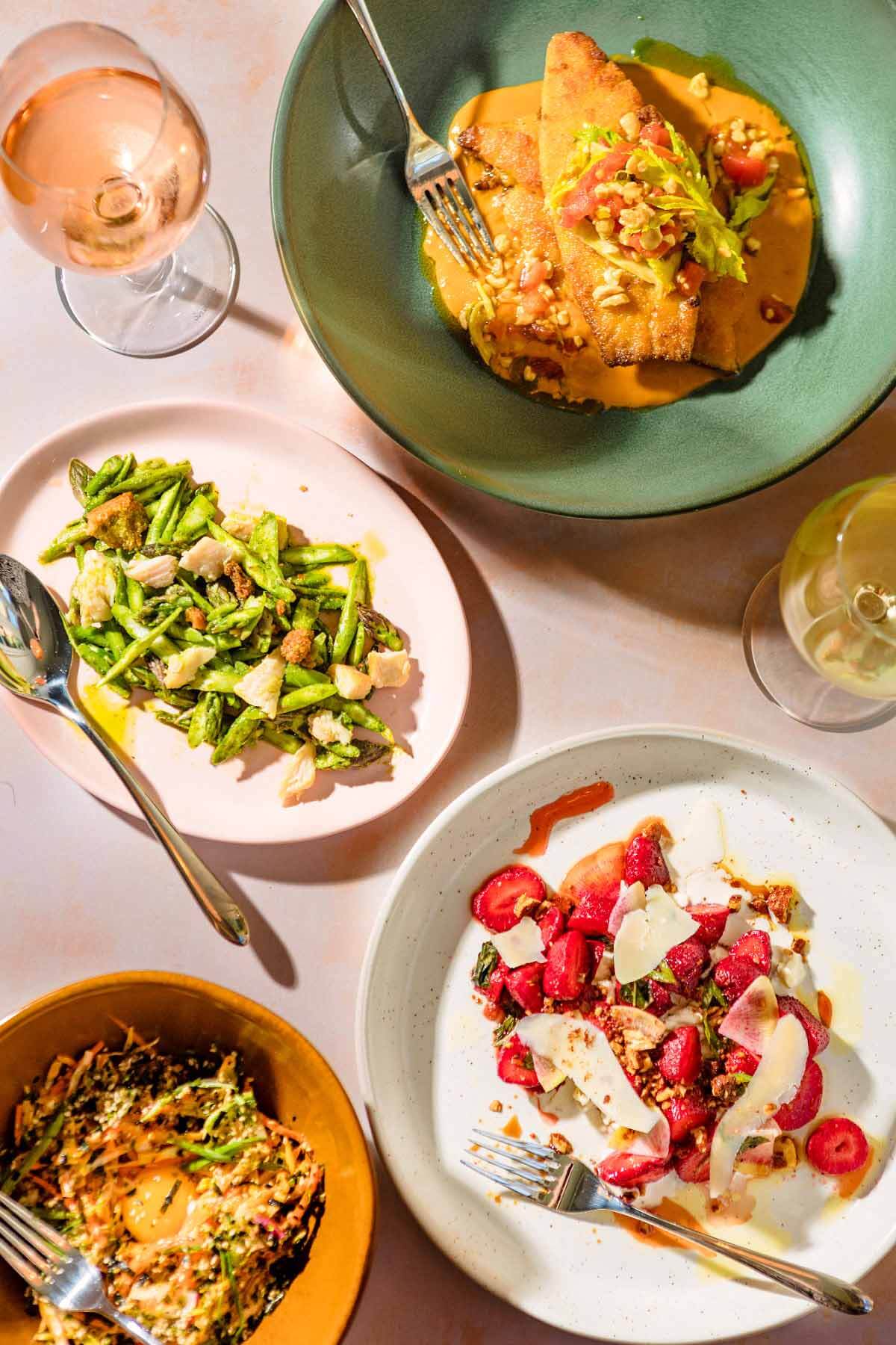 The dishes at Lenoir are almost too pretty to eat. (Almost!) Image: Baxter Miller Spread of food and wine from Lenoir