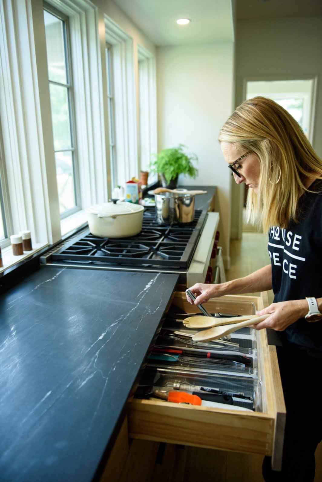 Tara organizing a kitchen junk drawer