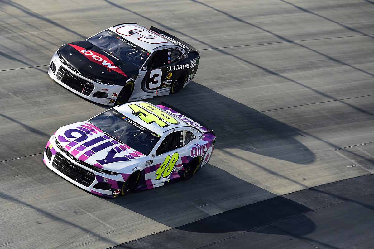 Two cars racing at Ally 400, a race that's part of the Music City Racing Trifecta