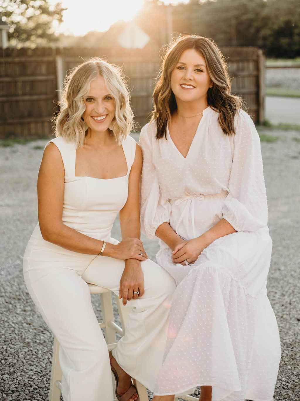 Meet our newest FACES, Mollie Walker and Lauren Brown. Mollie Walker and Lauren Brown, sitting on stools and wearing white