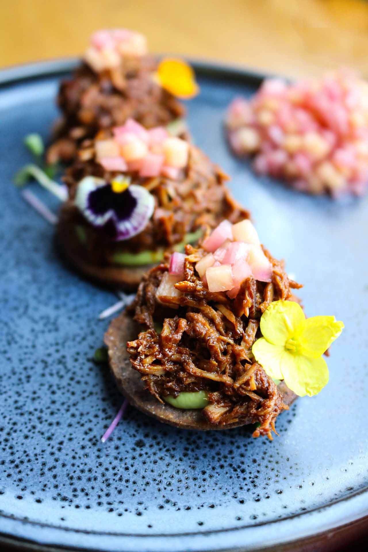 Artfully plated braised brisket tostadas are fine examples of CAMP's elevated international cuisine. Image: CAMP Braised beef tostadas from CAMP Modern American Eatery