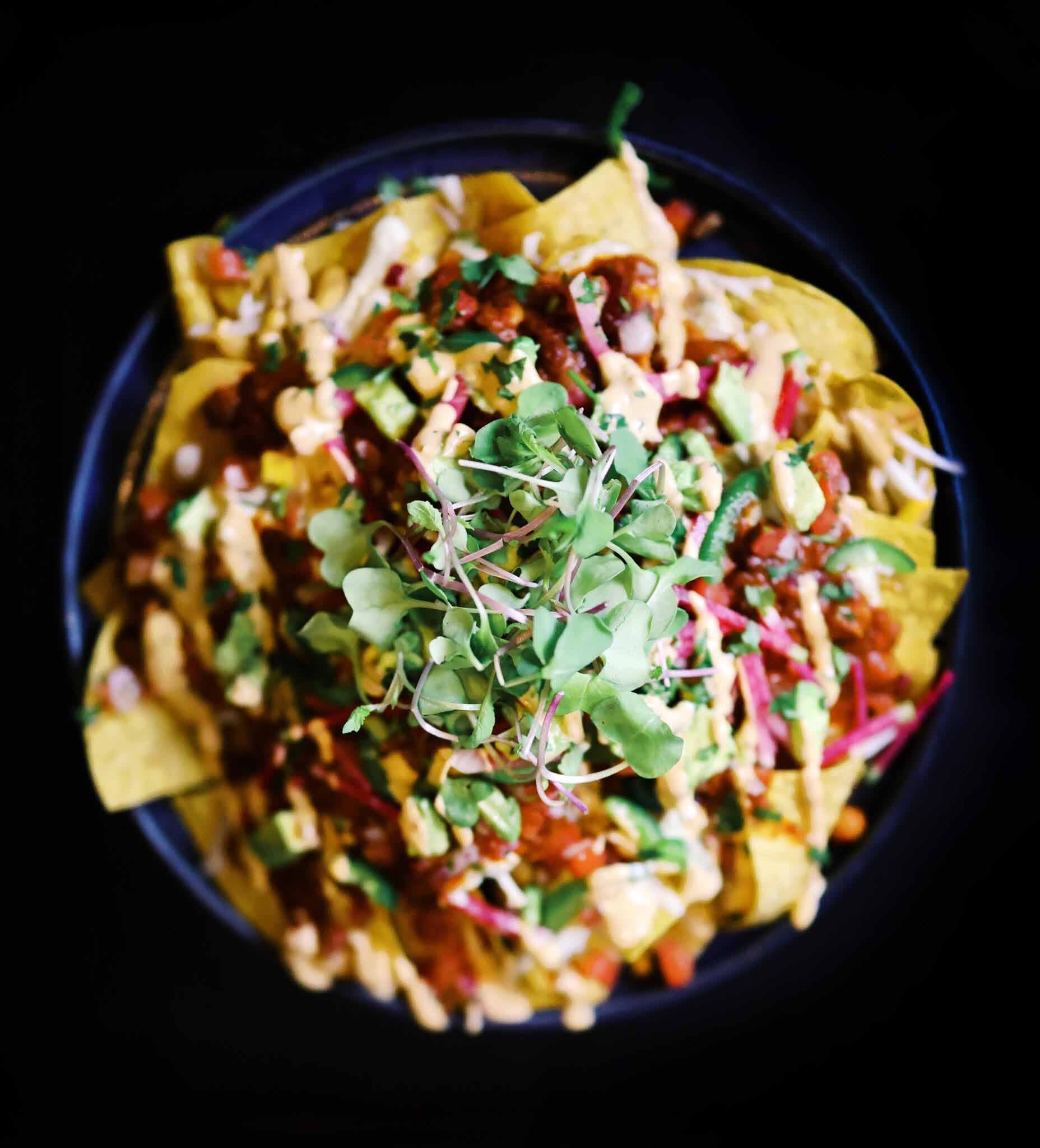 The three-bean nachos at Dom's are an excellent way to start off a meal. Image: Dom's Three-bean nachos from Dom's