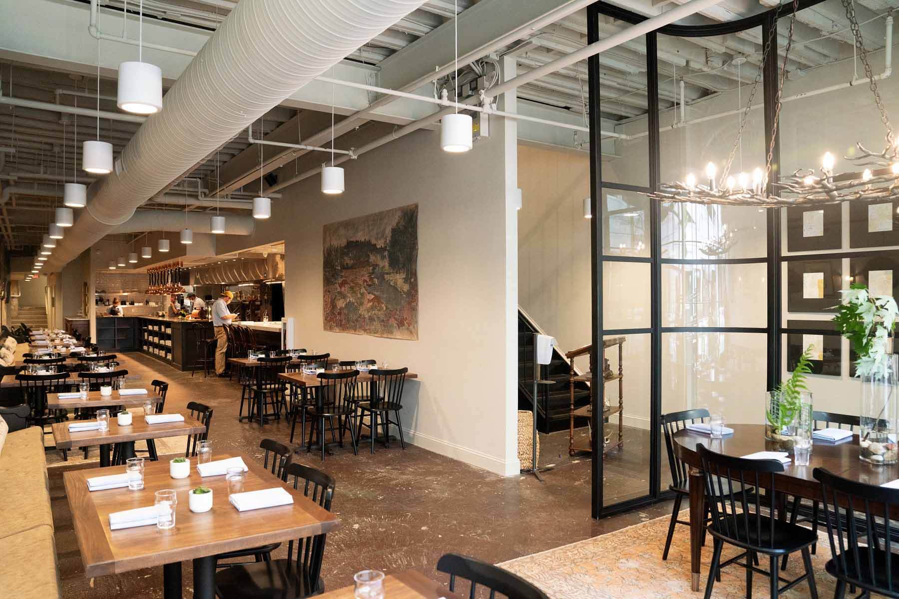 The narrow, two-story shotgun-style building that houses Helen has been around since the 1920s, but it still manages to exude a modern ambiance thanks to some stunning decor. Image: Cary Norton Interior of Helen, a new Southern restaurant