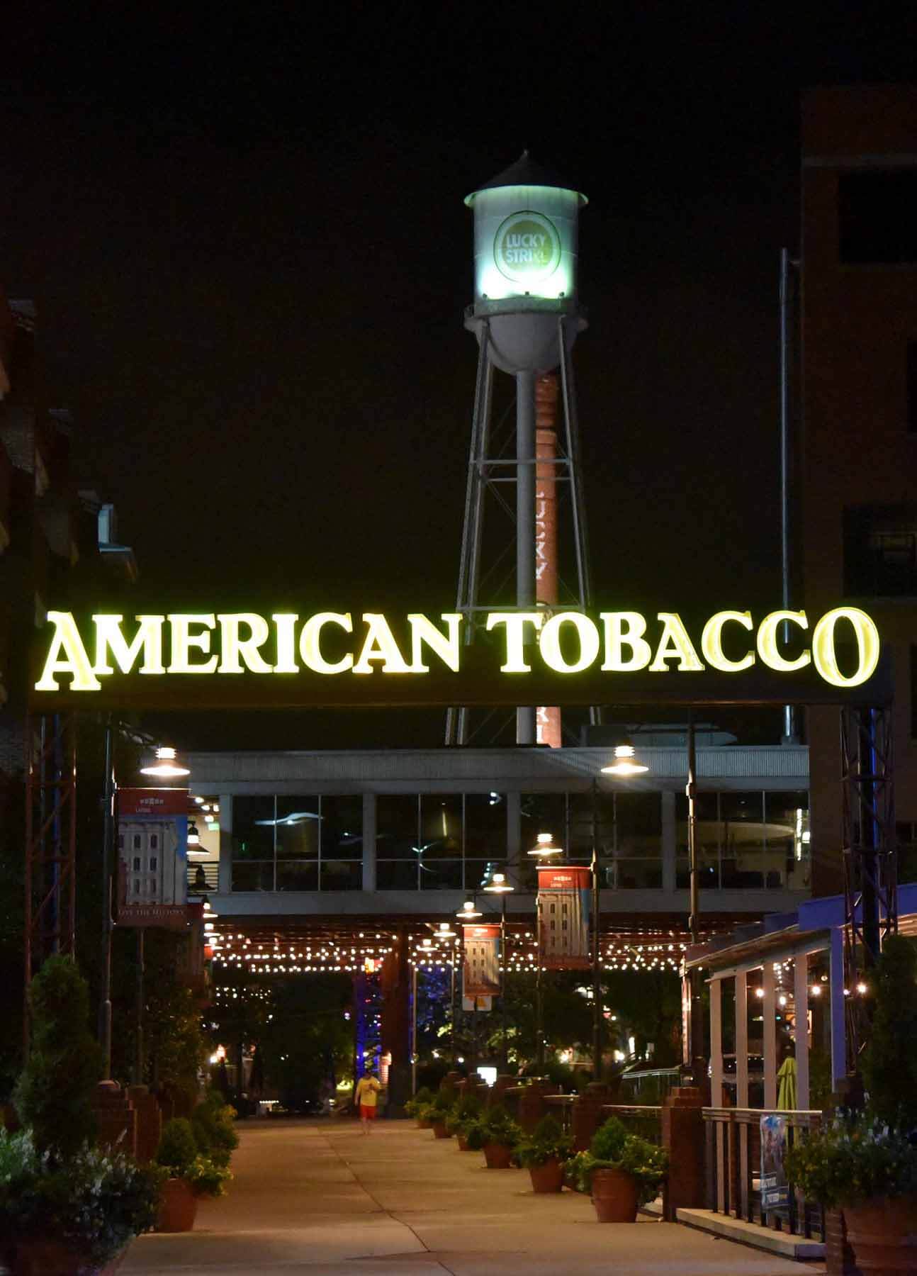The American Tobacco Campus at night with glowing sign